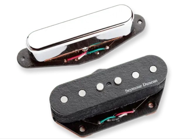 Close-up of Seymour Duncan guitar pickups and electronic audio components used in consumer electronics and EMC compliance testing.